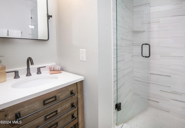 bathroom with vanity and an enclosed shower