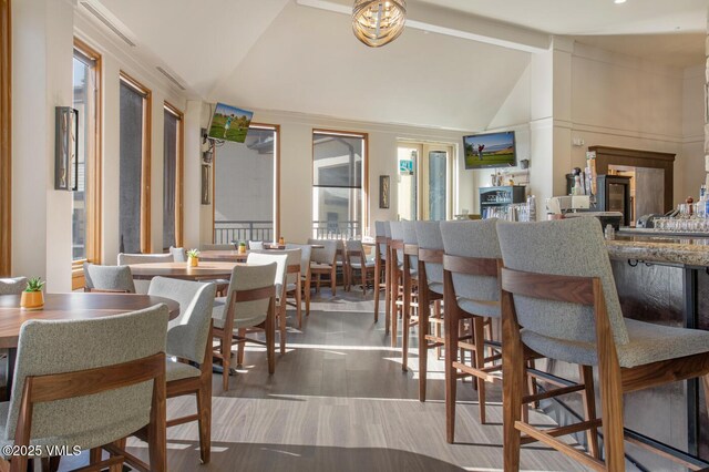 120 Offerson Rd Unit 7320, Beaver Creek, CO 81620 - dining area featuring lofted ceiling and wood finished floors