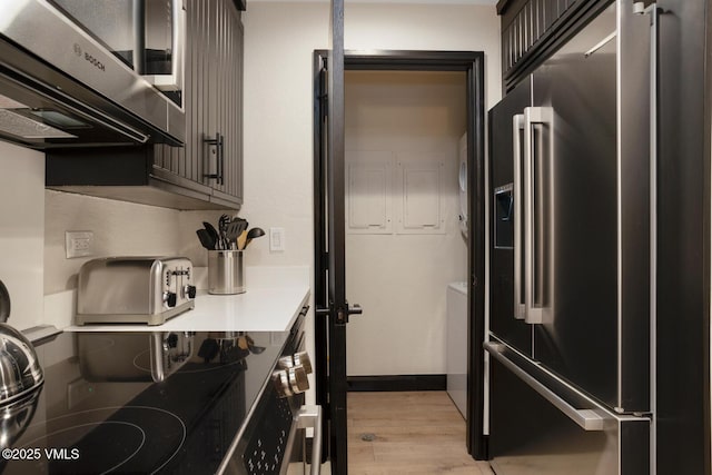 120 Offerson Rd Unit 7320, Beaver Creek, CO 81620 - kitchen with high end fridge, light countertops, and light wood-style floors