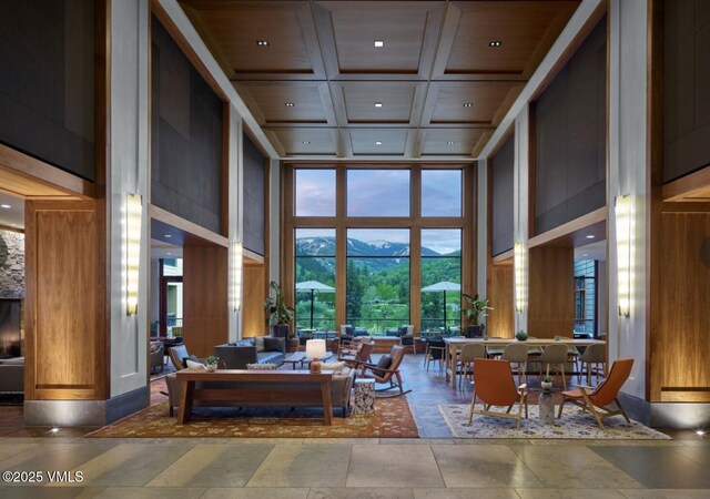 126 Riverfront Ln Unit 345, Avon, CO 81620 - lobby featuring a high ceiling, coffered ceiling, recessed lighting, and beam ceiling