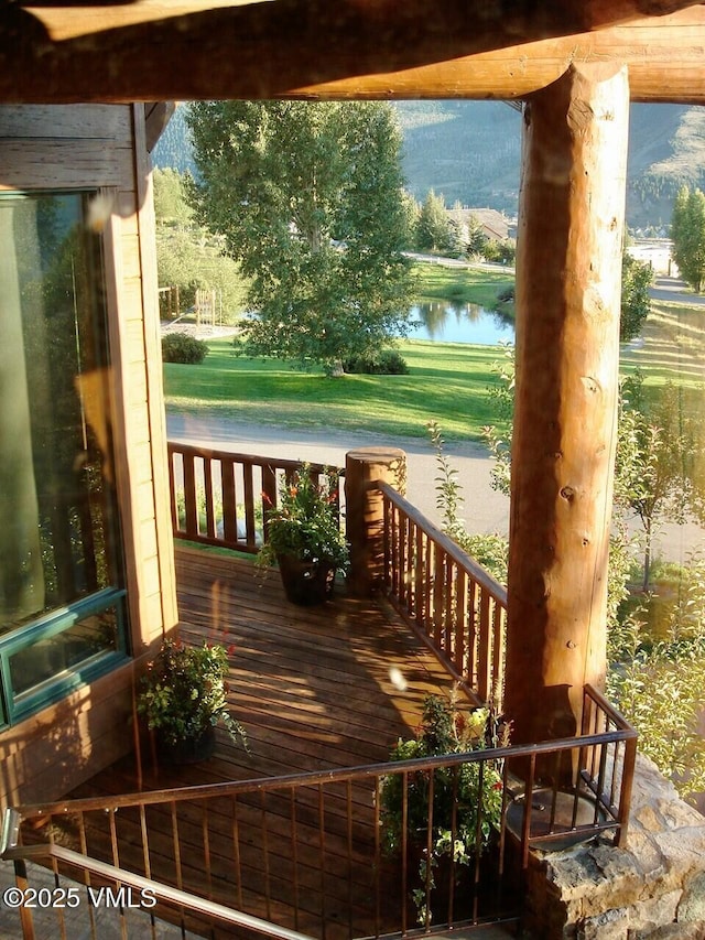 555 Charolais Cir, Edwards, CO 81632 - wooden porch featuring a water view and a yard