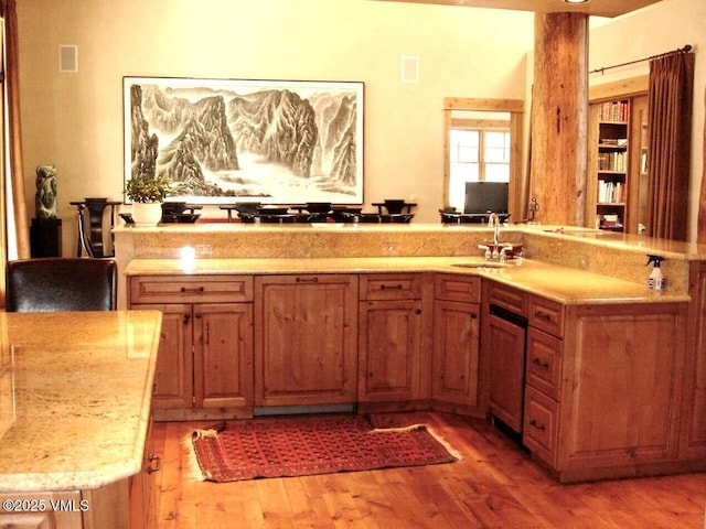 555 Charolais Cir, Edwards, CO 81632 - kitchen featuring light wood finished floors and brown cabinets