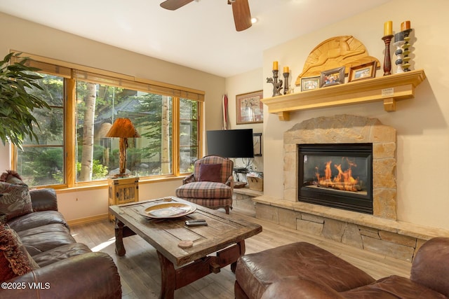74 Cresta Rd Unit 106, Edwards, CO 81632 - living area with a fireplace, plenty of natural light, wood finished floors, a ceiling fan, and recessed lighting