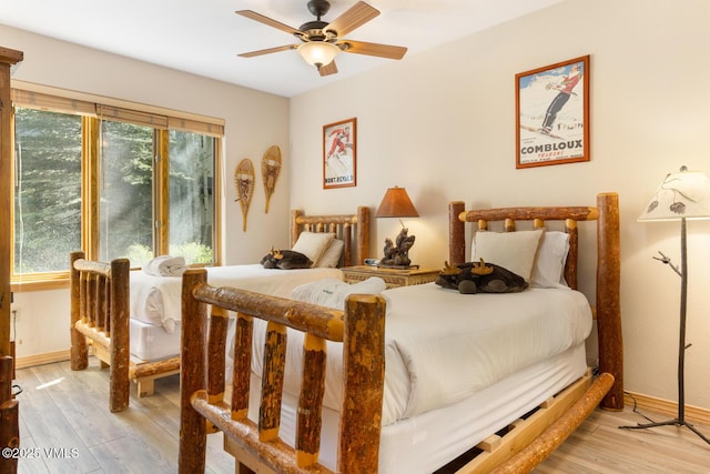 74 Cresta Rd Unit 106, Edwards, CO 81632 - bedroom with light wood-style flooring, baseboards, and a ceiling fan