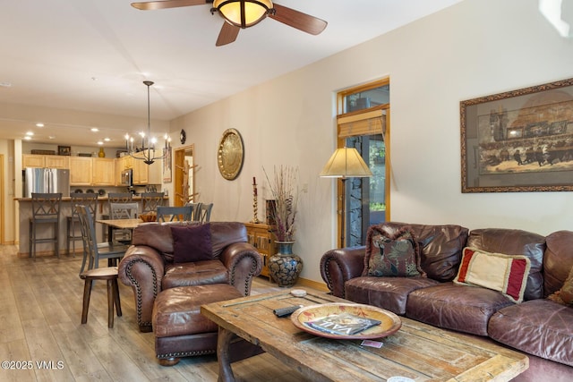 74 Cresta Rd Unit 106, Edwards, CO 81632 - living room with a chandelier, light wood finished floors, and a ceiling fan