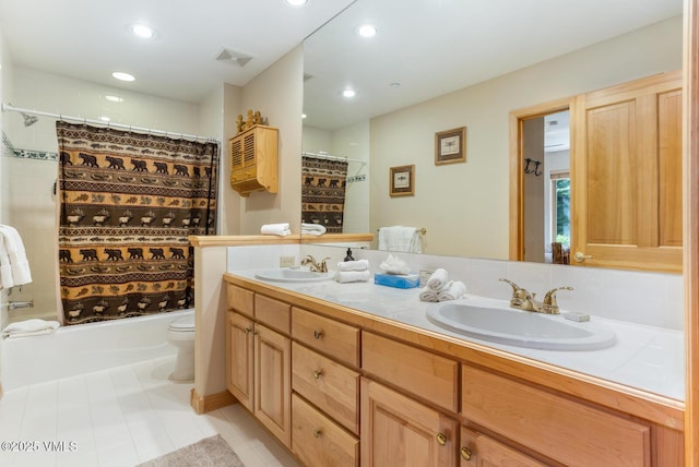 74 Cresta Rd Unit 106, Edwards, CO 81632 - full bath featuring double vanity, toilet, shower / bath combo, tile patterned floors, and recessed lighting