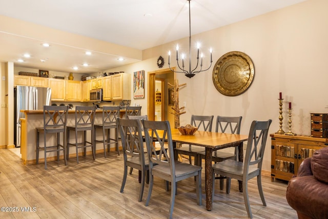 74 Cresta Rd Unit 106, Edwards, CO 81632 - dining room with light wood-style flooring, a chandelier, and recessed lighting
