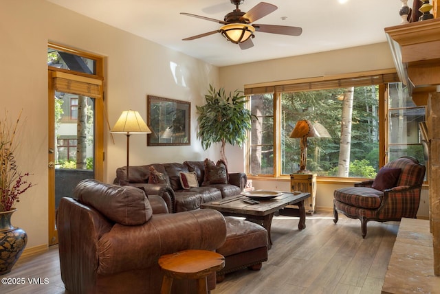 74 Cresta Rd Unit 106, Edwards, CO 81632 - living area featuring wood finished floors, ceiling fan, and baseboards
