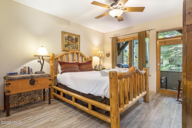 74 Cresta Rd Unit 106, Edwards, CO 81632 - bedroom featuring access to exterior, light wood finished floors, and ceiling fan