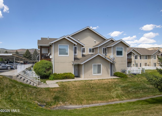 127 Jules Dr Unit D-204, Gypsum, CO 81637 - back of house featuring roof with shingles and stairway