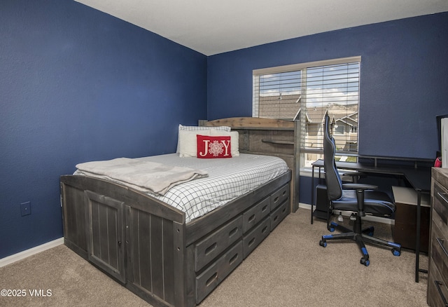 127 Jules Dr Unit D-204, Gypsum, CO 81637 - bedroom with light carpet, baseboards, and a desk