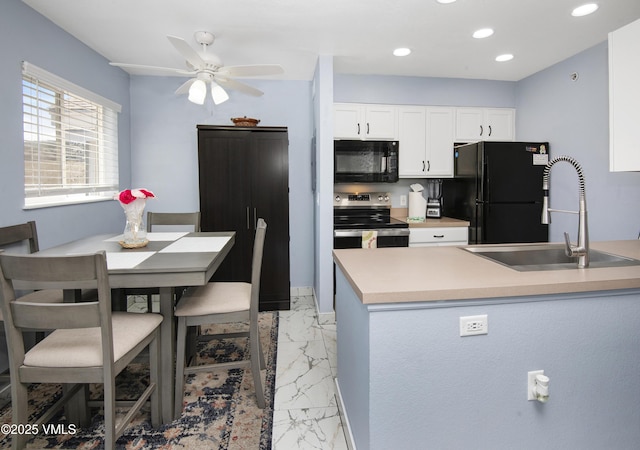 127 Jules Dr Unit D-204, Gypsum, CO 81637 - kitchen with black appliances, a sink, light marble finish flooring, white cabinetry, and a ceiling fan