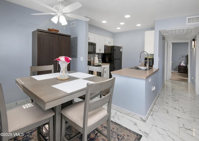 127 Jules Dr Unit D-204, Gypsum, CO 81637 - dining area featuring electric panel, recessed lighting, light marble finish floors, ceiling fan, and baseboards