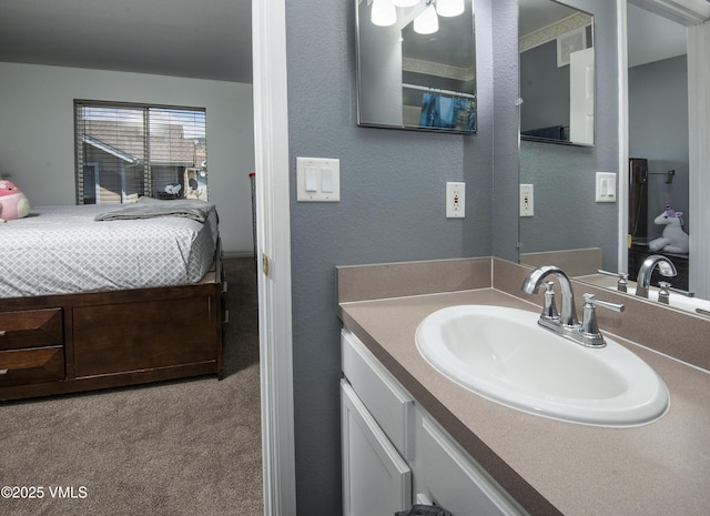 127 Jules Dr Unit D-204, Gypsum, CO 81637 - bathroom with vanity and a textured wall