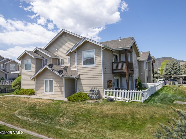 127 Jules Dr Unit D-204, Gypsum, CO 81637 - rear view of house with a balcony and roof with shingles