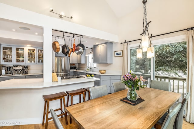 dining space with recessed lighting and lofted ceiling