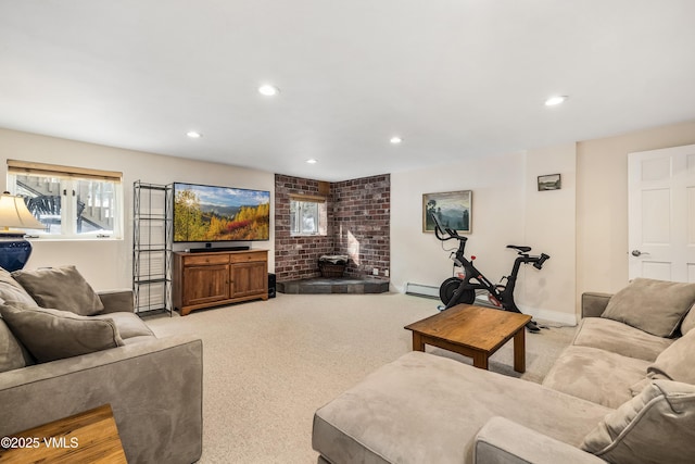 living area with light carpet, a baseboard heating unit, recessed lighting, baseboards, and a wood stove