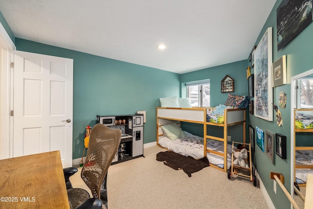 carpeted bedroom with baseboards