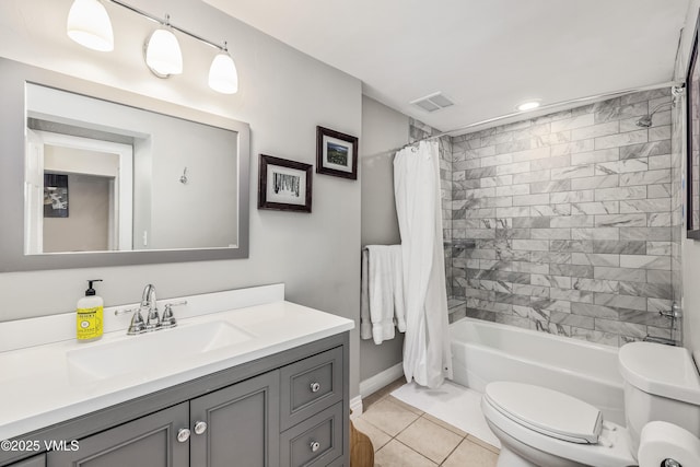 bathroom featuring vanity, visible vents, tile patterned flooring, toilet, and shower / tub combo with curtain