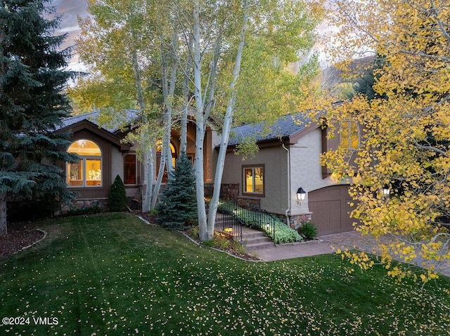 view of front of property with a lawn