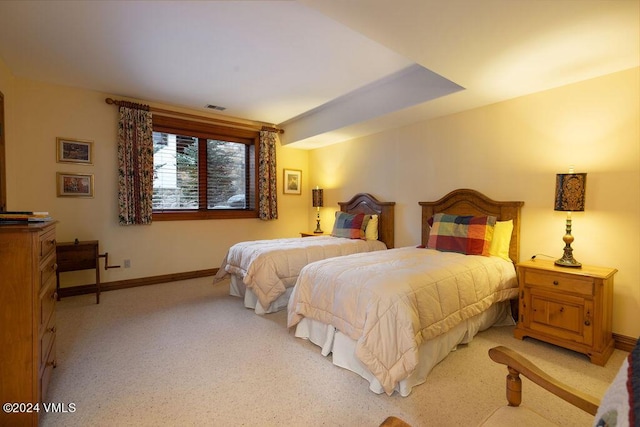 bedroom with light colored carpet