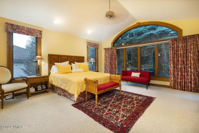 carpeted bedroom featuring lofted ceiling