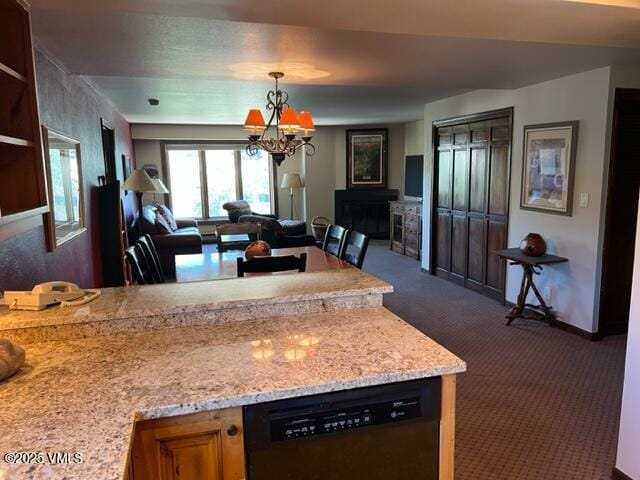 kitchen with a chandelier, open floor plan, dishwasher, and dark colored carpet