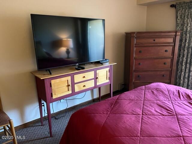 bedroom featuring baseboards