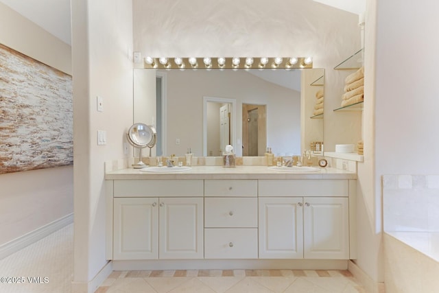 21 Hackamore Rd W, Edwards, CO 81632 - bathroom featuring double vanity and baseboards