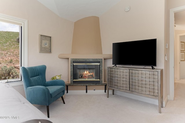 21 Hackamore Rd W, Edwards, CO 81632 - carpeted living room featuring a fireplace, lofted ceiling, plenty of natural light, and baseboards