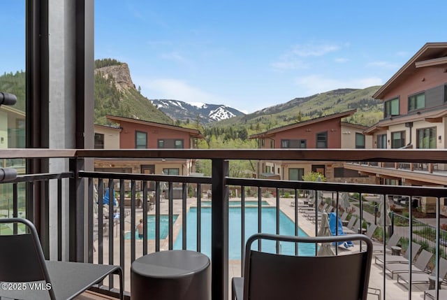 42 Riverfront Ln Unit 104, Avon, CO 81620 - balcony with a mountain view and view of pool