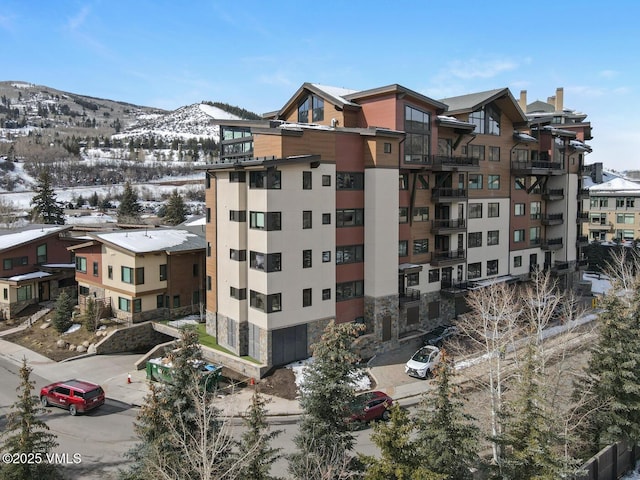 42 Riverfront Ln Unit 104, Avon, CO 81620 - snow covered property featuring a mountain view