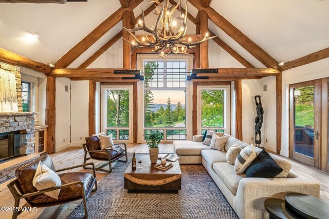 37 Hawley Ct, Edwards, CO 81632 - living room featuring high vaulted ceiling, a chandelier, beam ceiling, wood finished floors, and plenty of natural light