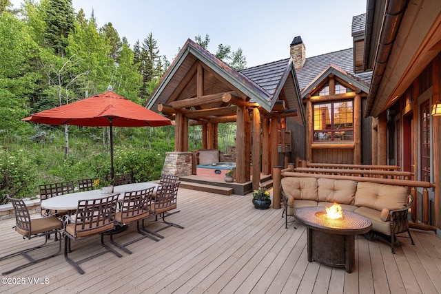37 Hawley Ct, Edwards, CO 81632 - wooden terrace with outdoor dining area, a fire pit, and an outdoor hot tub