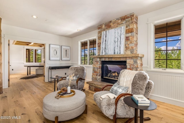 37 Hawley Ct, Edwards, CO 81632 - living area with a fireplace, light wood-style floors, a wainscoted wall, and recessed lighting