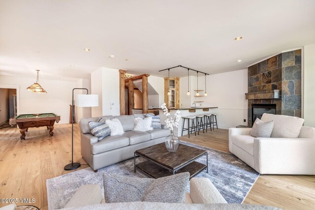 37 Hawley Ct, Edwards, CO 81632 - living area featuring light wood-style floors, billiards table, a large fireplace, and recessed lighting