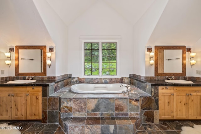 37 Hawley Ct, Edwards, CO 81632 - full bath featuring two vanities, a bath, and vaulted ceiling