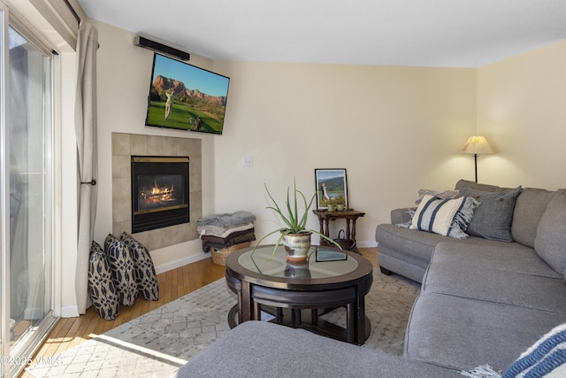 205 Hurd Ln Unit 4311, Avon, CO 81620 - living room with a tile fireplace, baseboards, and wood finished floors