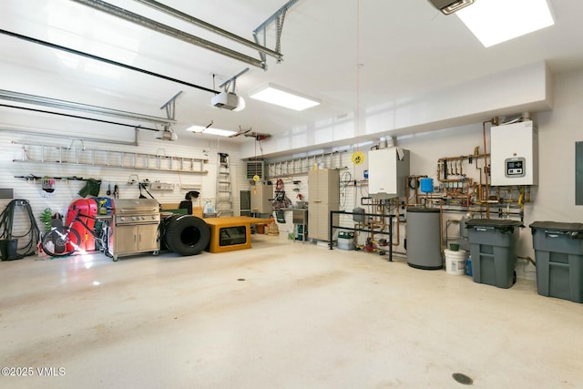 garage featuring a garage door opener, water heater, and a workshop area