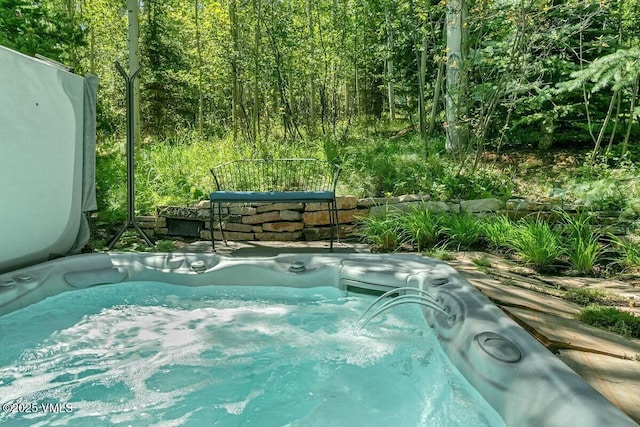 view of pool with a covered hot tub