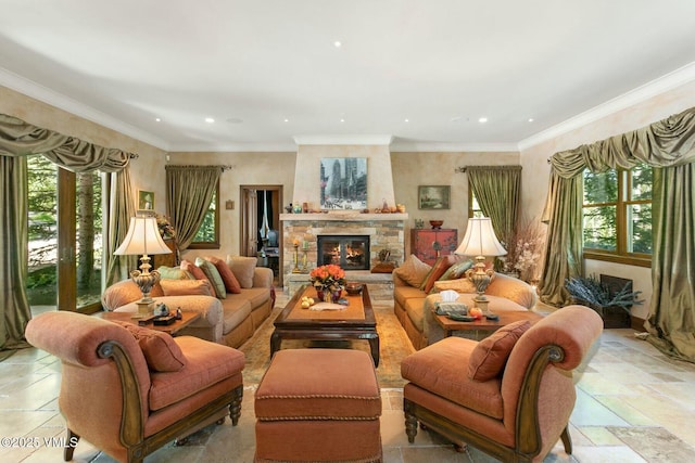 living room featuring crown molding, a fireplace, and a wealth of natural light