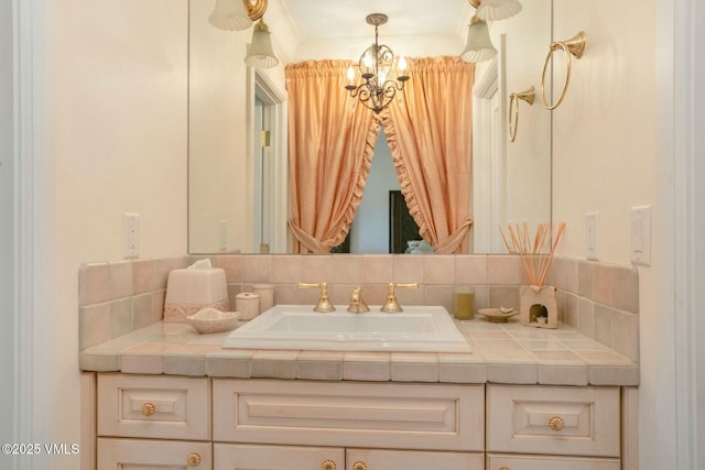 bathroom featuring a notable chandelier and vanity