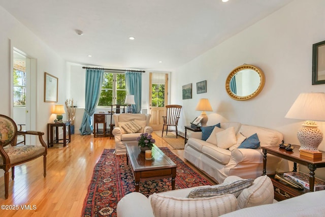 living area featuring recessed lighting and light wood-style floors