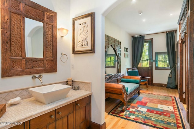 bathroom featuring wood finished floors and vanity