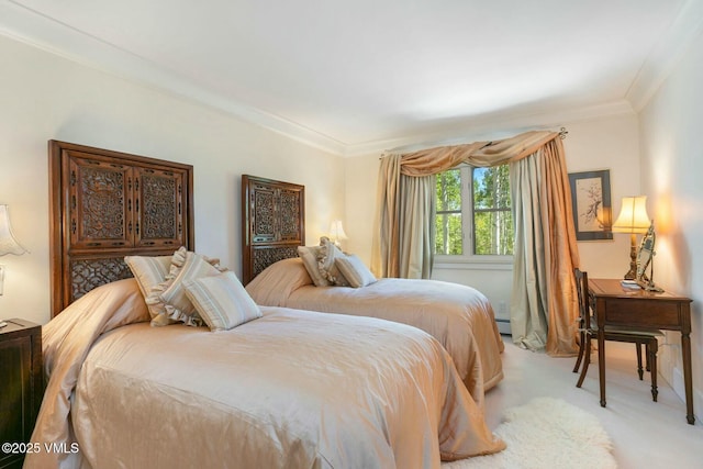 bedroom with a baseboard radiator, ornamental molding, and light colored carpet