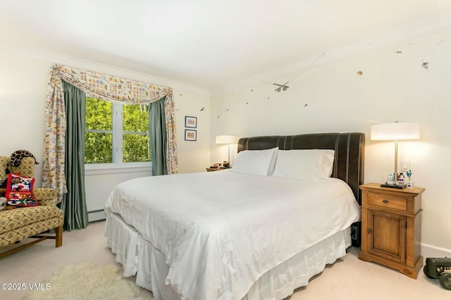 bedroom with light carpet and baseboard heating