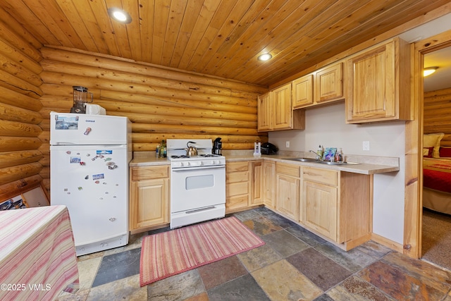 320 Mill, Eagle, CO 81631 - kitchen featuring white appliances, light brown cabinets, light countertops, recessed lighting, and dark stone finish flooring