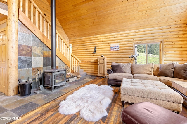 320 Mill, Eagle, CO 81631 - living room with high vaulted ceiling, rustic walls, a wood stove, hardwood / wood-style floors, and wood ceiling