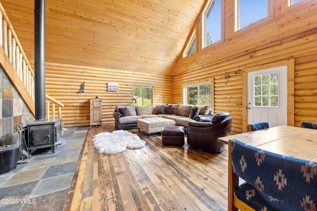 320 Mill, Eagle, CO 81631 - living room featuring high vaulted ceiling and a wood stove