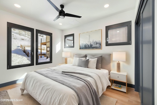 bedroom with light wood-style floors, recessed lighting, baseboards, and a ceiling fan